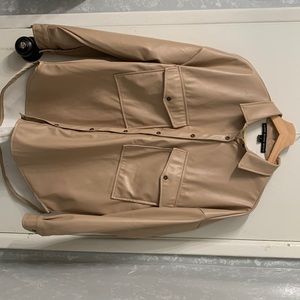 Beige leather oversized jacket .